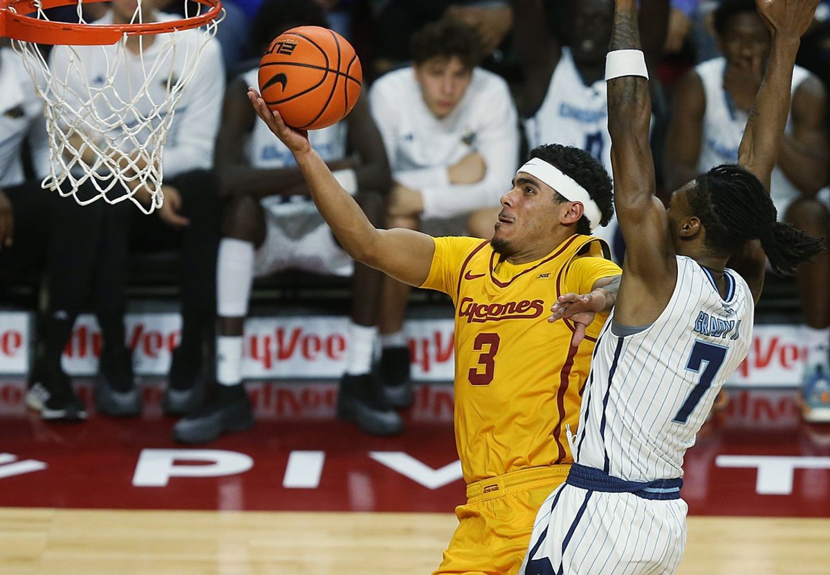 Iowa State cyclones guard Tamin Lipsey (3) lays up the ball around Kansas City Roos' guard Kasheem Grady II (7) during the first half in the NCAA men’s basketball at Hilton Coliseum on Monday, Nov. 11, 2024, in Ames, Iowa.