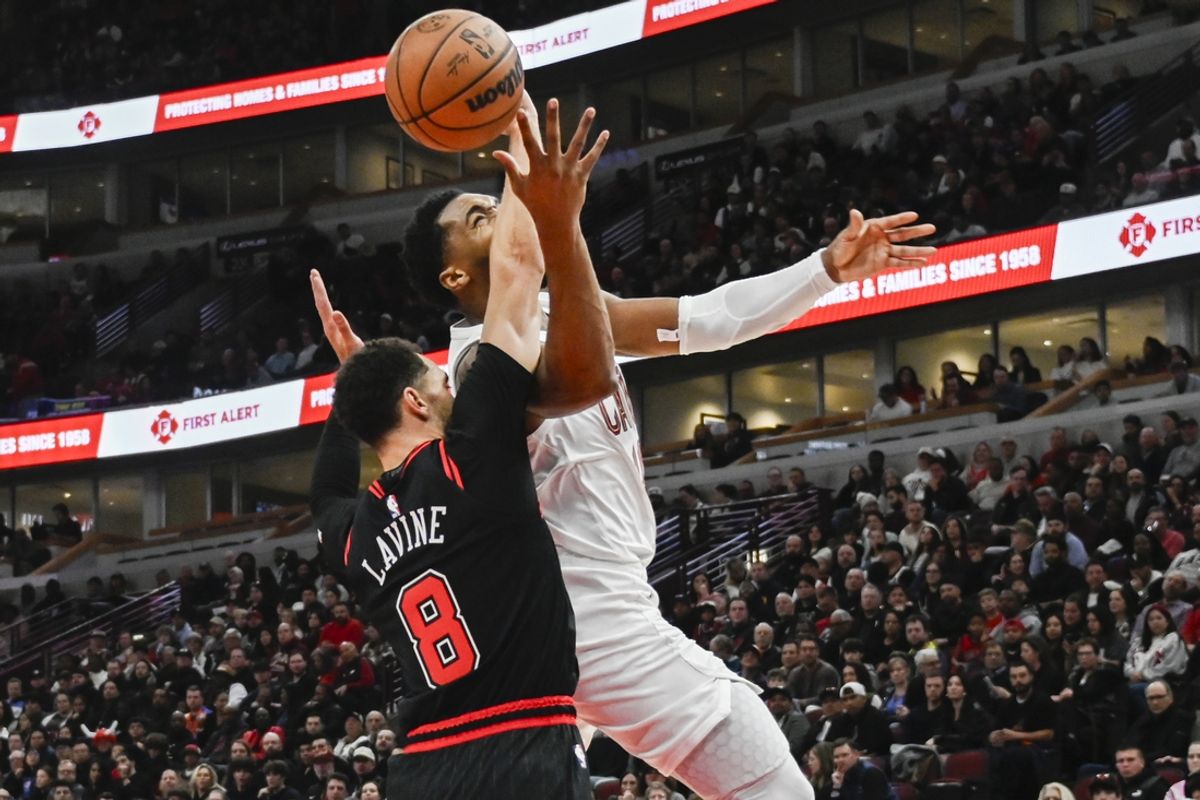 Nov 11, 2024; Chicago, Illinois, USA;  Cleveland Cavaliers guard Donovan Mitchell (45) drives to the basket against Chicago Bulls guard Zach LaVine (8) during the first half at United Center. Mandatory Credit: Matt Marton-Imagn Images