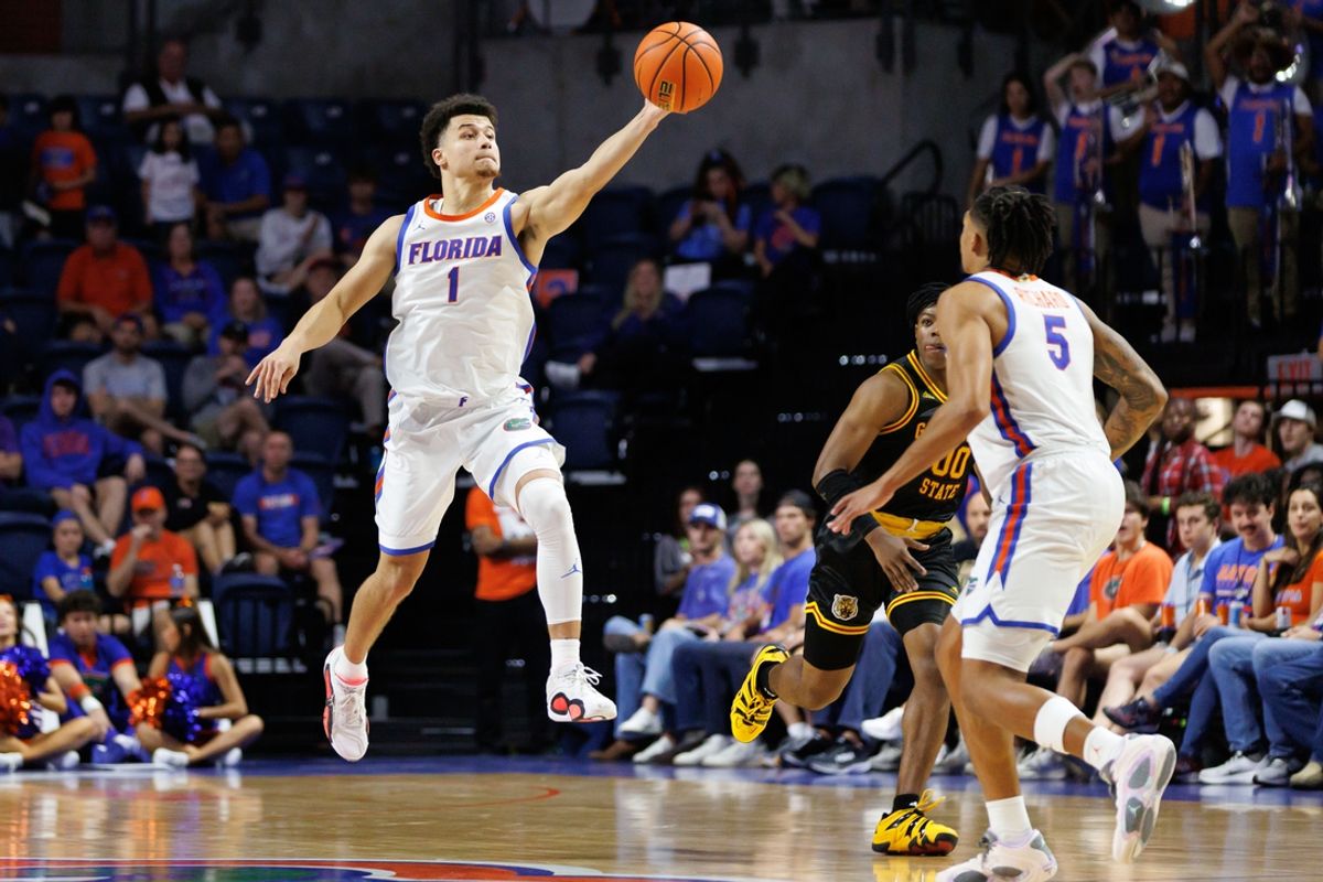 Nov 11, 2024; Gainesville, Florida, USA; Florida Gators guard Walter Clayton Jr. (1) reaches to pass the ball to Florida Gators guard Will Richard (5) against the Grambling State Tigers during the second half at Exactech Arena at the Stephen C. O'Connell Center. Mandatory Credit: Matt Pendleton-Imagn Images