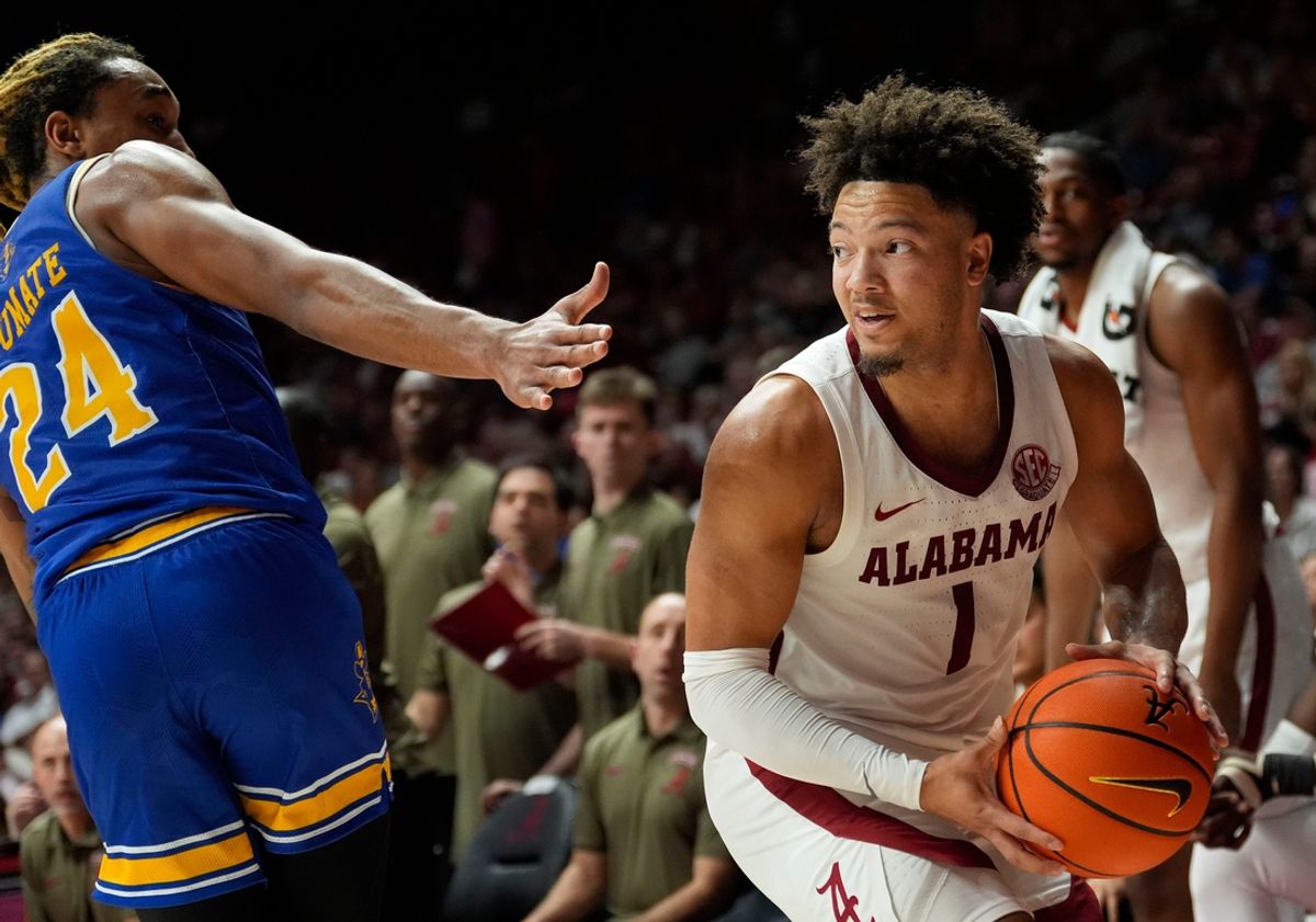 Nov 11, 2024; Tuscaloosa, AL, USA; McNeese forward Christian Shumate (24) guards Alabama guard Mark Sears (1) at Coleman Coliseum. Alabama defeated McNeese 72-64. Mandatory Credit: Gary Cosby Jr.-Tuscaloosa News