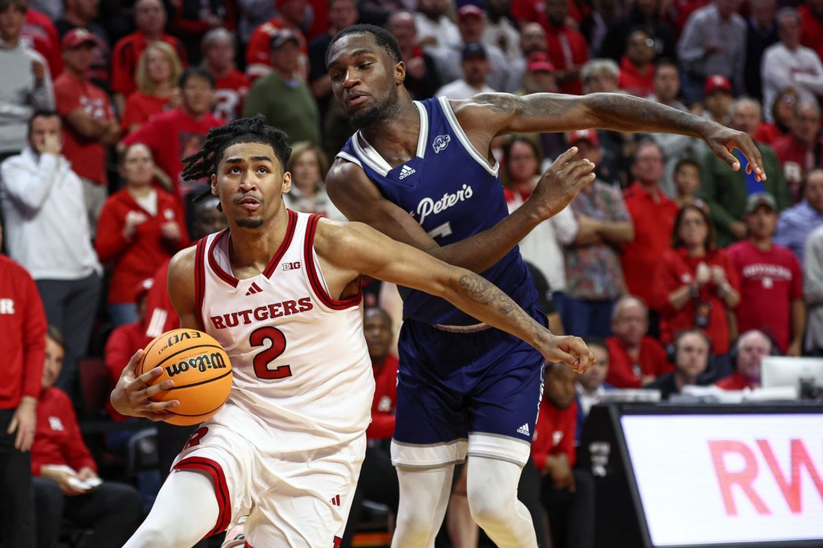 Nov 11, 2024; Piscataway, New Jersey, USA; Rutgers Scarlet Knights guard Dylan Harper (2) drives to the basket as St. Peter's Peacocks forward Stephon Roberts (15) defends during the second half at Jersey Mike's Arena. Mandatory Credit: Vincent Carchietta-Imagn Images