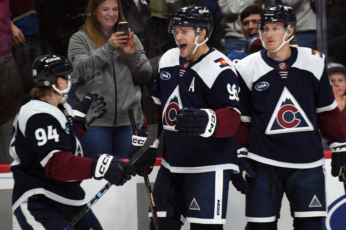 Nov 11, 2024; Denver, Colorado, USA; Colorado Avalanche right wing Mikko Rantanen (96) celebrates with left wing Joel Kiviranta (94) after a goal during the second period against the Nashville Predators at Ball Arena. Mandatory Credit: Christopher Hanewinckel-Imagn Images