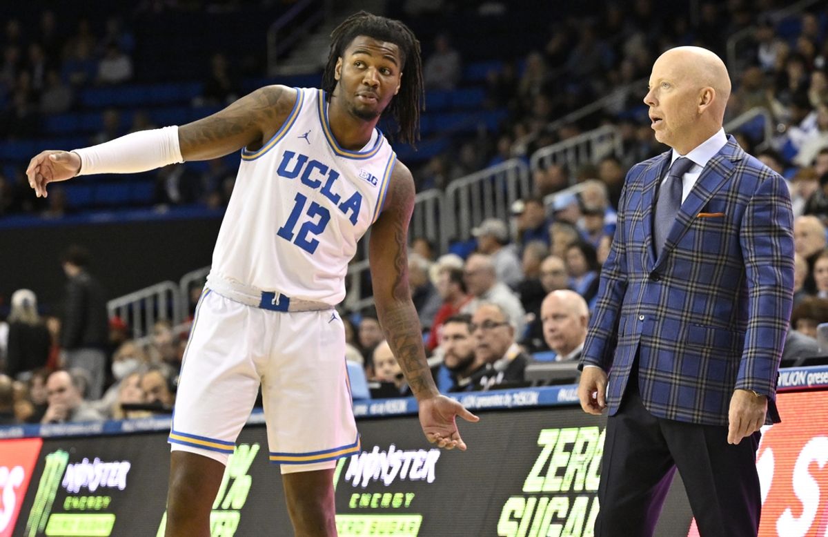 Nov 11, 2024; Los Angeles, California, USA; UCLA Bruins head coach Mick Cronin talks to guard Sebastian Mack (12) during the first half against the Boston University Terriers  at Pauley Pavilion presented by Wescom. Mandatory Credit: Robert Hanashiro-Imagn Images