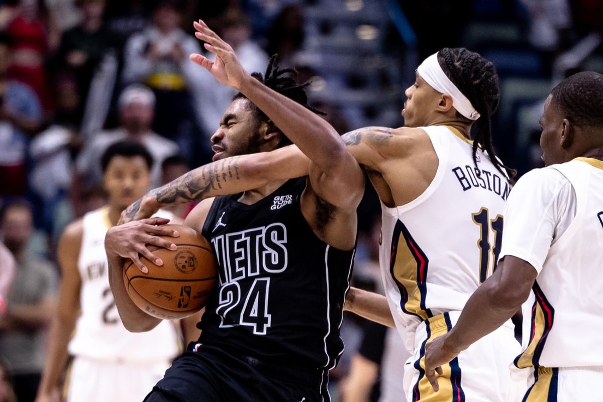 Nov 11, 2024; New Orleans, Louisiana, USA;  New Orleans Pelicans guard Brandon Boston Jr. (11) fouls Brooklyn Nets guard Cam Thomas (24) during the second half at Smoothie King Center. Mandatory Credit: Stephen Lew-Imagn Images