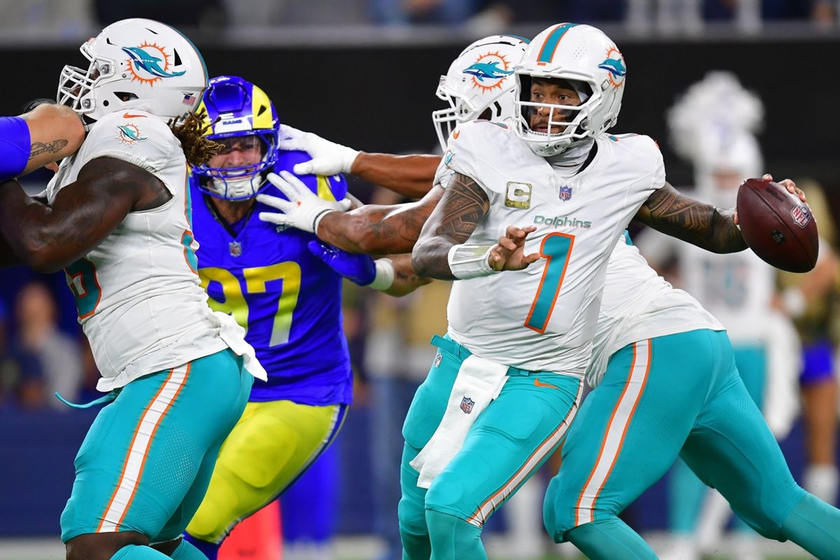 Nov 11, 2024; Inglewood, California, USA; Miami Dolphins quarterback Tua Tagovailoa (1) throws against the Los Angeles Rams during the first half at SoFi Stadium. Mandatory Credit: Gary A. Vasquez-Imagn Images