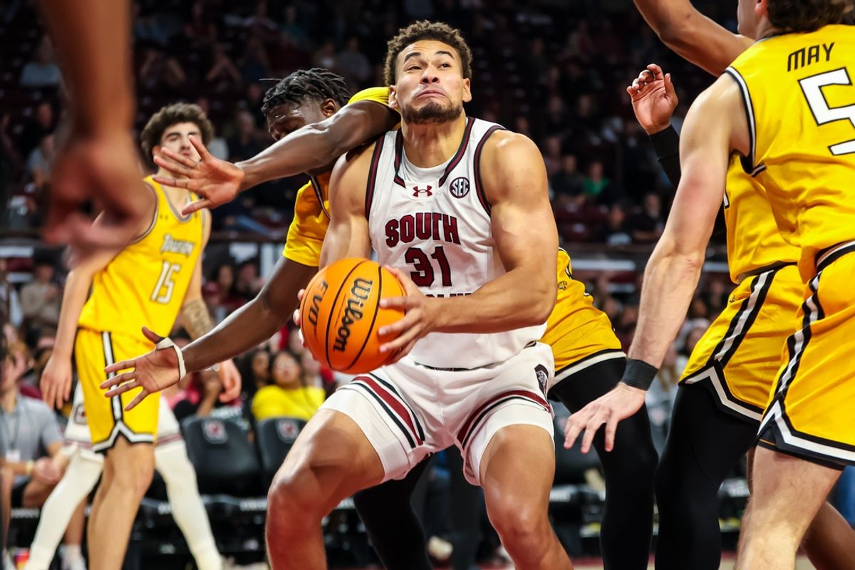 Nov 12, 2024; Columbia, South Carolina, USA; South Carolina Gamecocks forward Benjamin Bosmans-Verdonk (31) is fouled by Towson Tigers forward Abdou Samb (12) at Colonial Life Arena. Mandatory Credit: Jeff Blake-Imagn Images