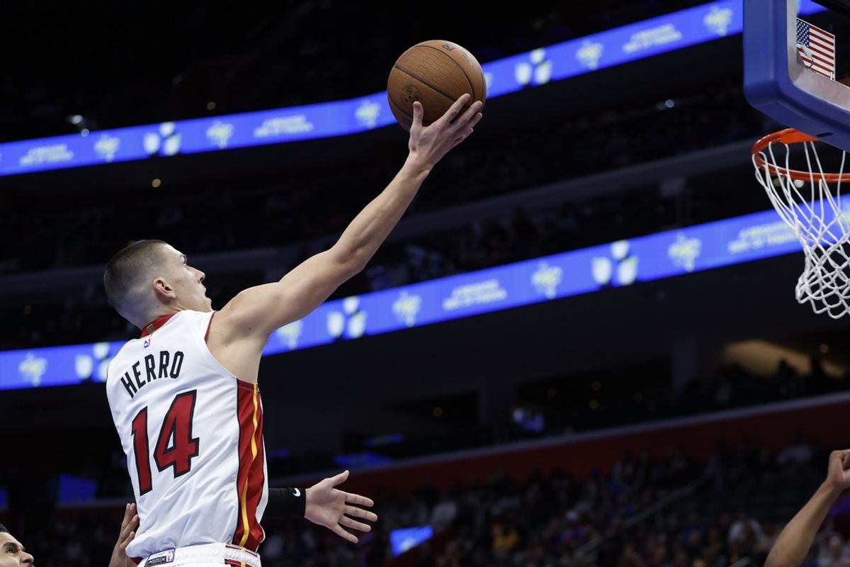 Nov 12, 2024; Detroit, Michigan, USA;  Miami Heat guard Tyler Herro (14) shoots in the first half against the Detroit Pistons at Little Caesars Arena. Mandatory Credit: Rick Osentoski-Imagn Images