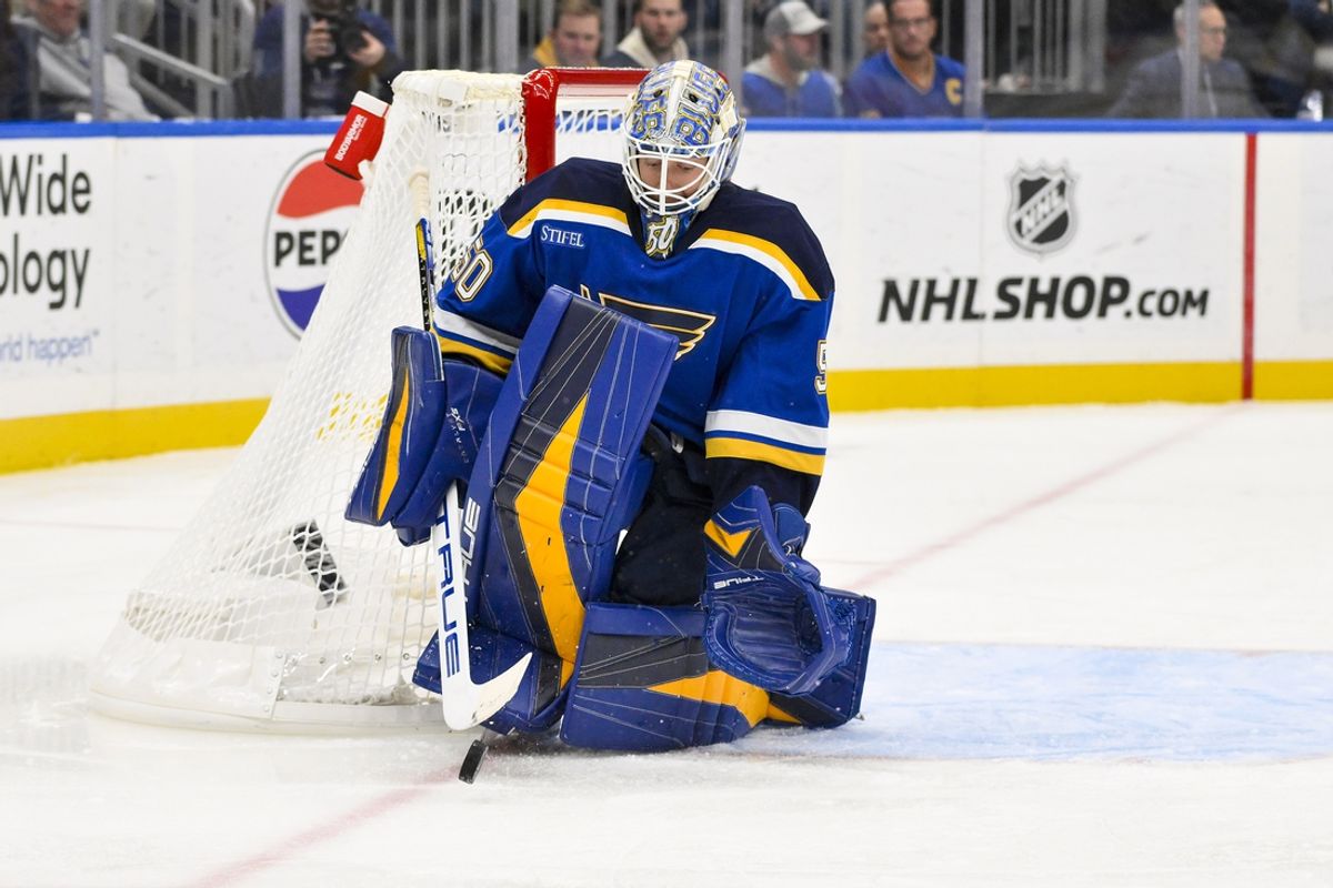 Nov 12, 2024; St. Louis, Missouri, USA;  St. Louis Blues goaltender Jordan Binnington (50) defends the net against the Boston Bruins during the first period at Enterprise Center. Mandatory Credit: Jeff Curry-Imagn Images