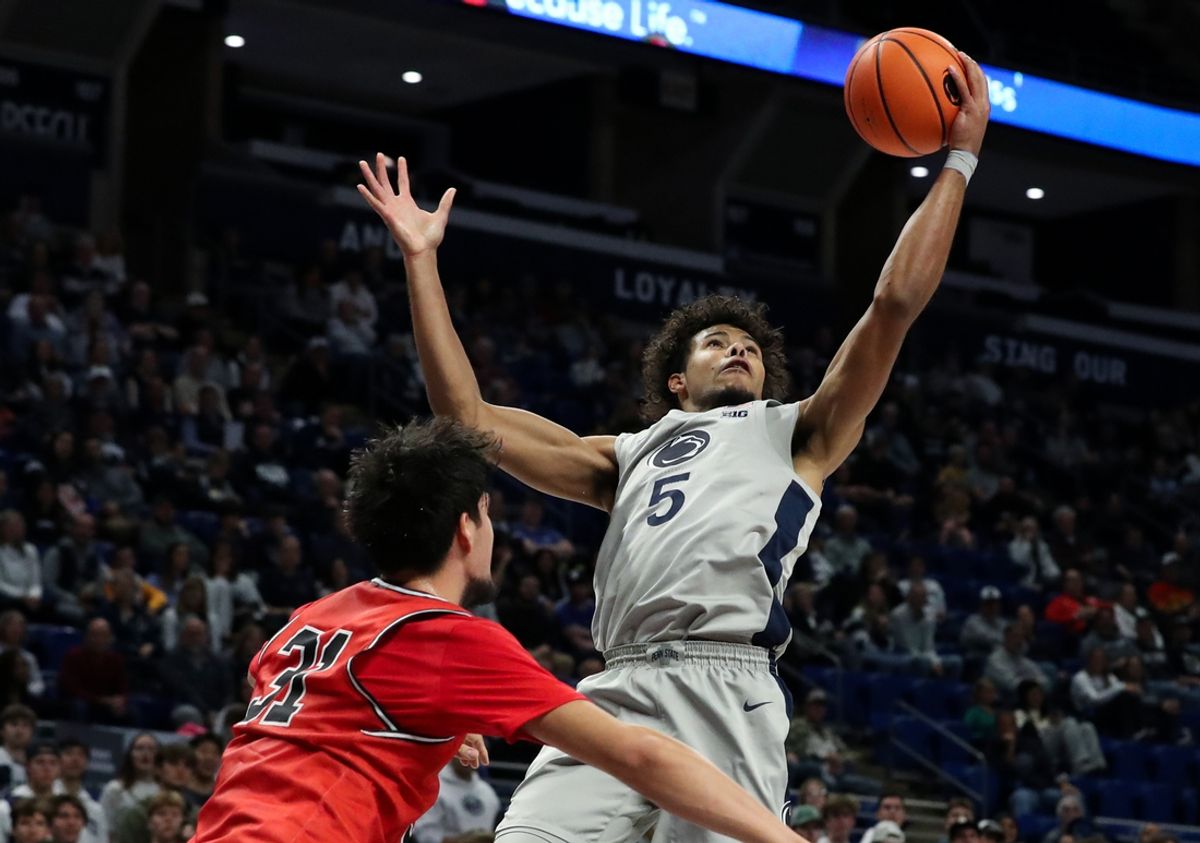 Nov 12, 2024; University Park, Pennsylvania, USA; Penn State Nittany Lions guard/forward Puff Johnson (5) reaches for the rebound during the first half against the Saint Francis Red Flash at Bryce Jordan Center. Penn State defeated Saint Francis 92-62. Mandatory Credit: Matthew O'Haren-Imagn Images