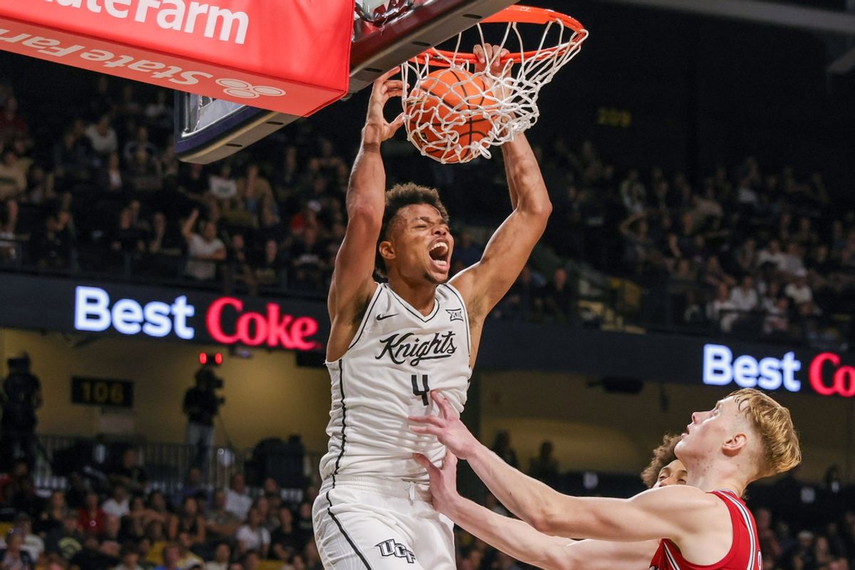Nov 12, 2024; Orlando, Florida, USA; UCF Knights guard Keyshawn Hall (4) dunks during the second half against the Florida Atlantic Owls at Addition Financial Arena. Mandatory Credit: Mike Watters-Imagn Images