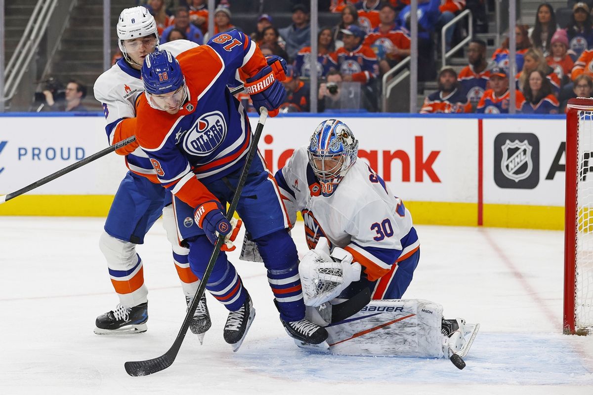 Nov 12, 2024; Edmonton, Alberta, CAN; Edmonton Oilers forward Zach Hyman (18) deflects a shot just wide of New York Islanders goaltender Ilya Sorokin (30) during the first period at Rogers Place. Mandatory Credit: Perry Nelson-Imagn Images