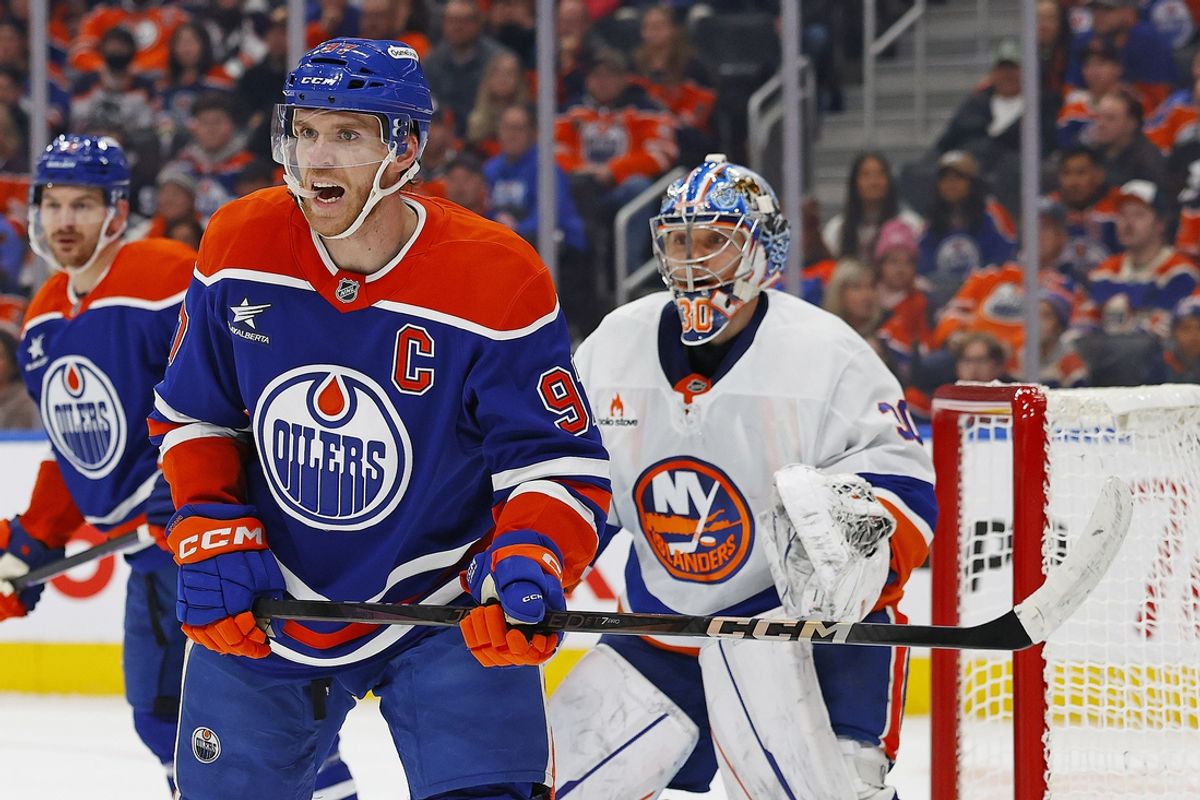 Nov 12, 2024; Edmonton, Alberta, CAN; Edmonton Oilers forward Connor McDavid (97) looks for a loose puck in front of New York Islanders goaltender Ilya Sorokin (30) during the first period at Rogers Place. Mandatory Credit: Perry Nelson-Imagn Images