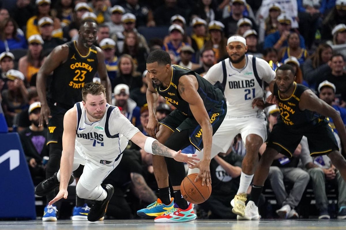 Nov 12, 2024; San Francisco, California, USA; Dallas Mavericks guard Luka Doncic (77) loses control of the ball next to Golden State Warriors guard De'Anthony Melton (8) in the fourth quarter at the Chase Center. Mandatory Credit: Cary Edmondson-Imagn Images