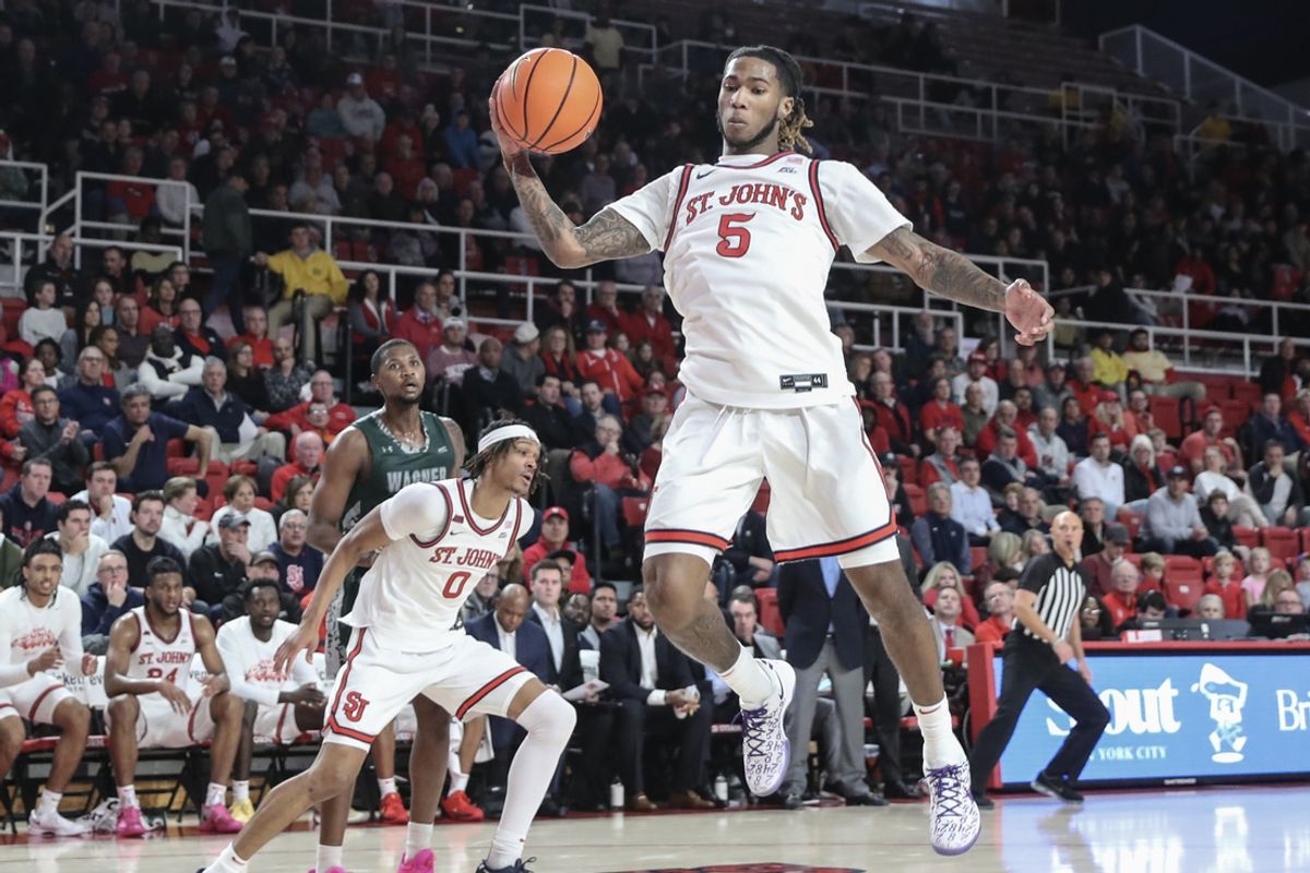 Nov 13, 2024; Queens, New York, USA;  St. John's Red Storm guard Deivon Smith (5) grabs a rebound in the first half against the Wagner Seahawks at Carnesecca Arena. Mandatory Credit: Wendell Cruz-Imagn Images