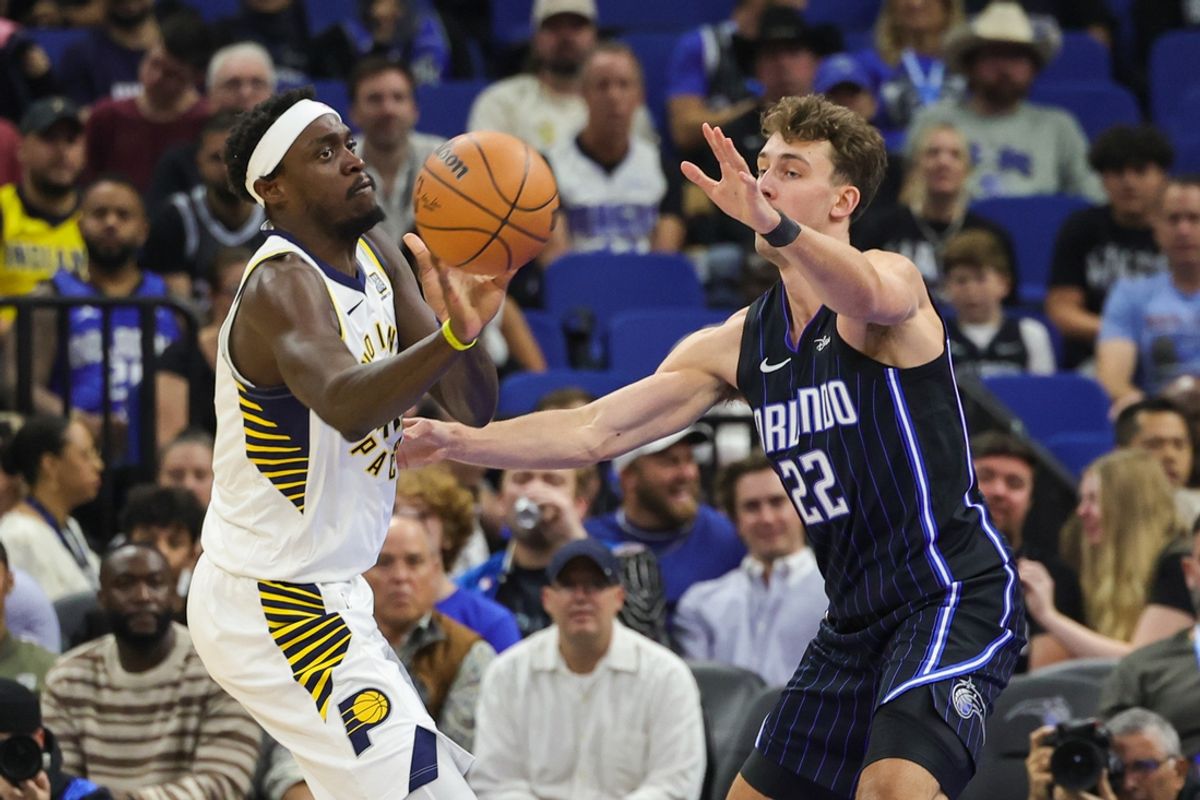 Nov 13, 2024; Orlando, Florida, USA; Indiana Pacers forward Pascal Siakam (43) passes the ball around Orlando Magic forward Franz Wagner (22) during the first quarter at Kia Center. Mandatory Credit: Mike Watters-Imagn Images