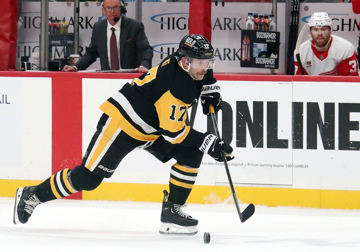 Nov 13, 2024; Pittsburgh, Pennsylvania, USA;  Pittsburgh Penguins right wing Bryan Rust (17) skates up ice with the puck against the Detroit Red Wings during the first period at PPG Paints Arena. Mandatory Credit: Charles LeClaire-Imagn Images