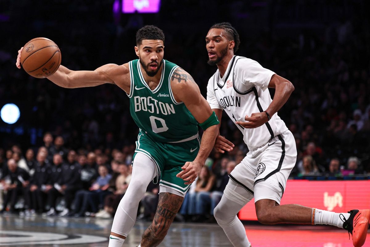 Nov 13, 2024; Brooklyn, New York, USA; Boston Celtics forward Jayson Tatum (0) loses control of the ball as Brooklyn Nets forward Ziaire Williams (1) defends during the first half at Barclays Center. Mandatory Credit: Vincent Carchietta-Imagn Images