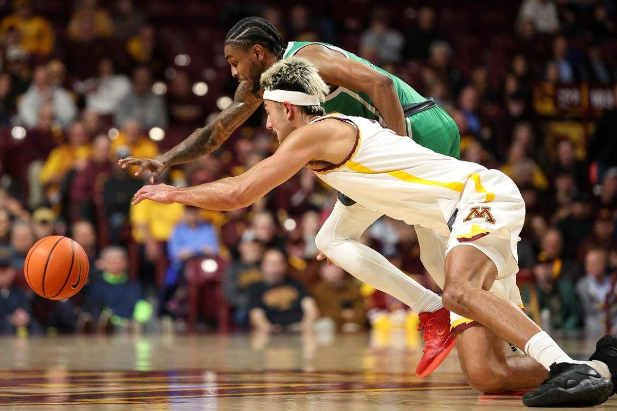 Nov 13, 2024; Minneapolis, Minnesota, USA; North Texas Mean Green guard Rondel Walker (5) and Minnesota Golden Gophers forward Dawson Garcia (3) dive for the ball during the first half at Williams Arena. Mandatory Credit: Matt Krohn-Imagn Images