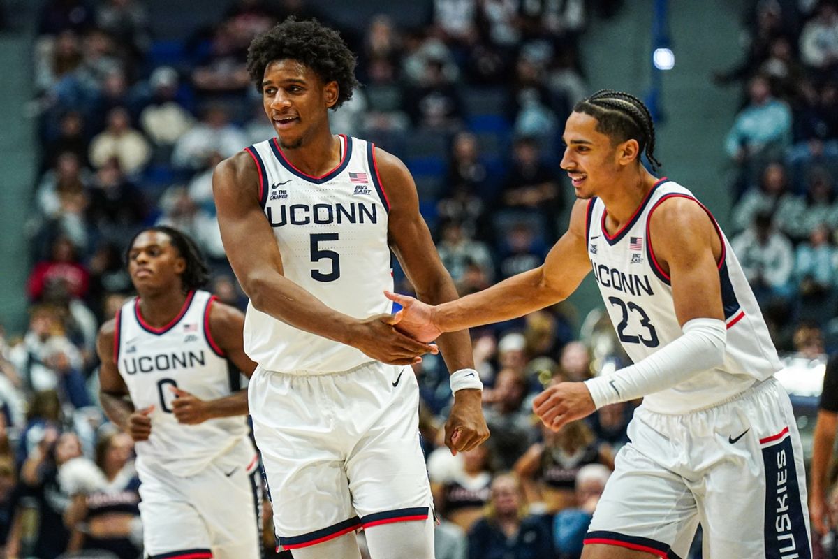 Nov 13, 2024; Storrs, Connecticut, USA; UConn Huskies center Tarris Reed Jr. (5) and forward Jayden Ross (23) react after a play against the Le Moyne Dolphins in the second half at Harry A. Gampel Pavilion. Mandatory Credit: David Butler II-Imagn Images