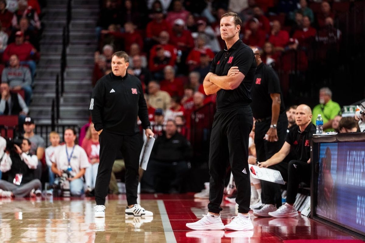 Nov 13, 2024; Lincoln, Nebraska, USA; Nebraska Cornhuskers head coach Fred Hoiberg and assistant coach Adam Howard watch play during the first half against the Fairleigh Dickinson Knights at Pinnacle Bank Arena. Mandatory Credit: Dylan Widger-Imagn Images