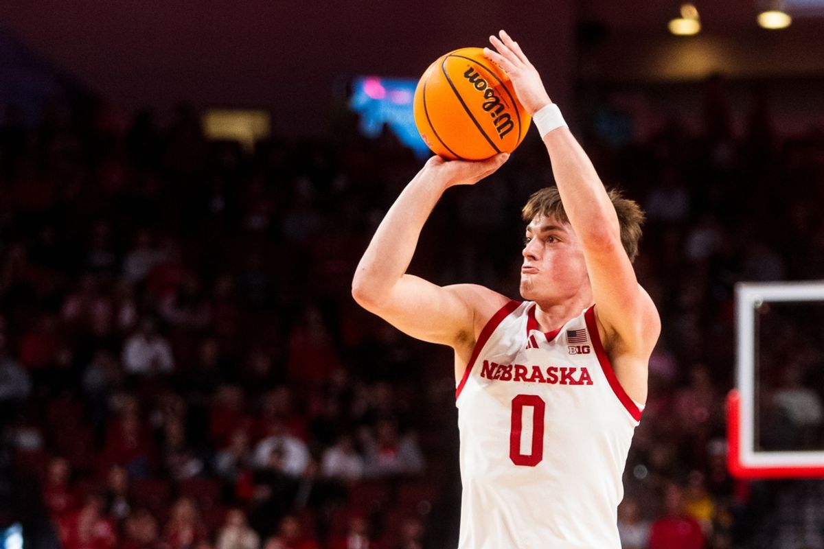 Nov 13, 2024; Lincoln, Nebraska, USA; Nebraska Cornhuskers guard Connor Essegian (0) shoots a three point basket against the Fairleigh Dickinson Knights during the first half at Pinnacle Bank Arena. Mandatory Credit: Dylan Widger-Imagn Images