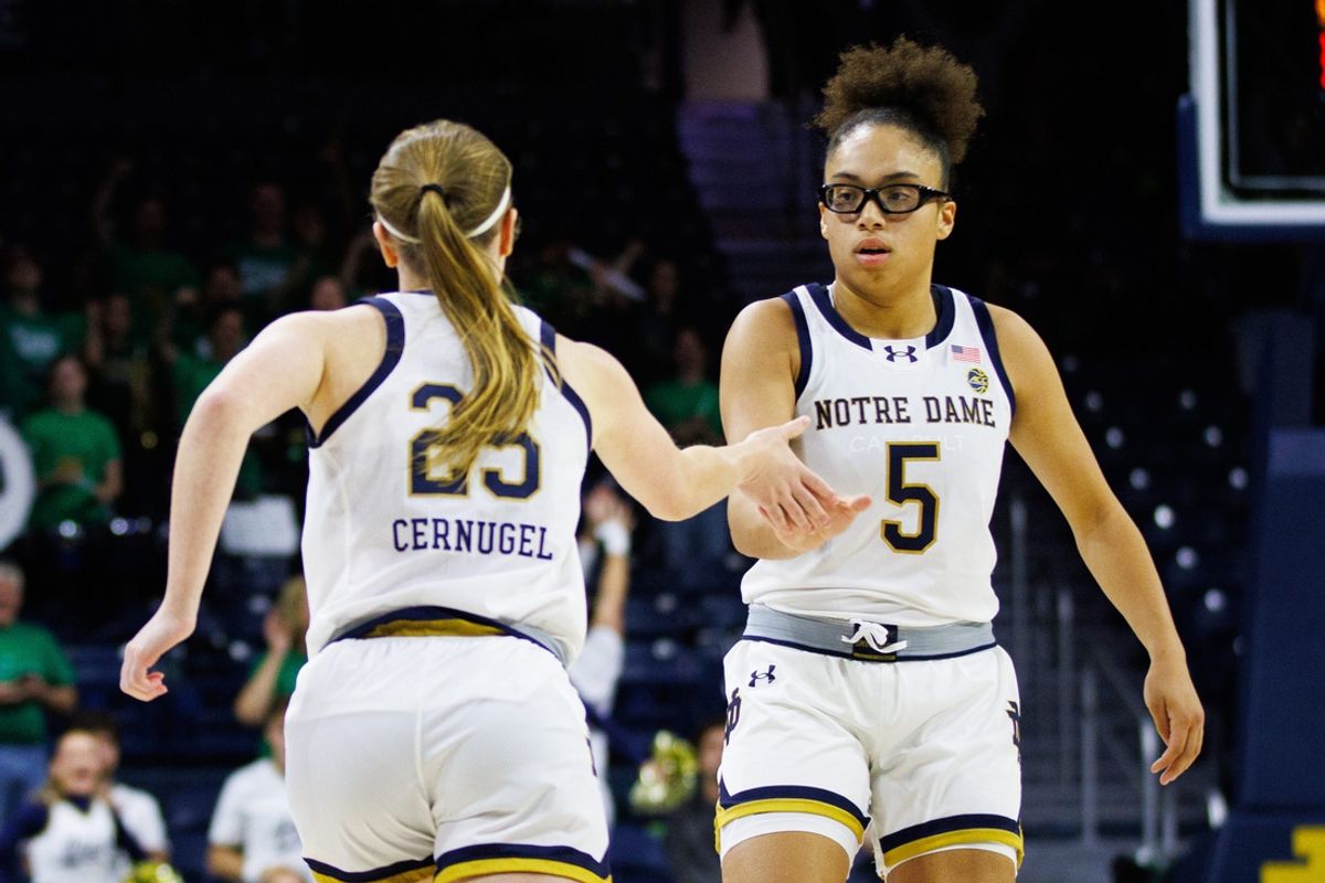 Notre Dame guard Olivia Miles (5) celebrates a three point shot made by guard Sarah Cernugel (25) during a NCAA women's basketball game against James Madison at Purcell Pavilion on Tuesday, Nov. 13, 2024, in South Bend.