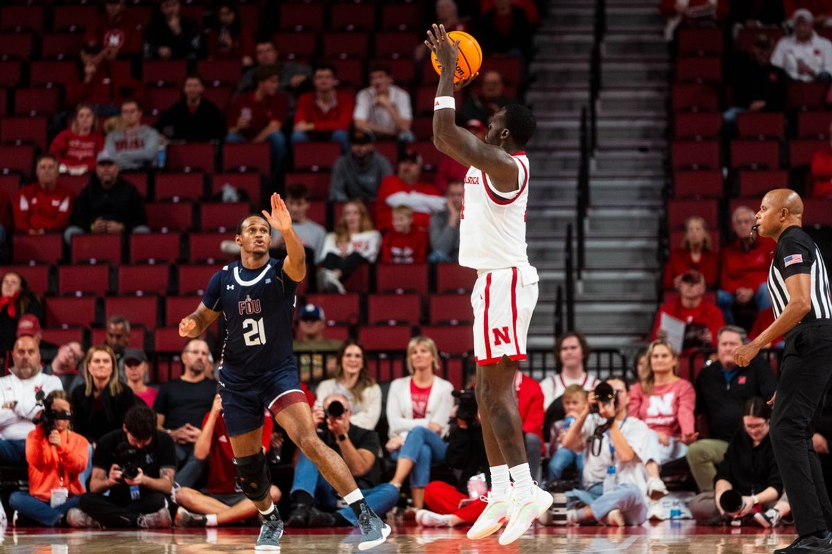 Nov 13, 2024; Lincoln, Nebraska, USA; Nebraska Cornhuskers forward Juwan Gary (4) shoots a three point basket against Fairleigh Dickinson Knights forward Cameron Tweedy (21) during the second half at Pinnacle Bank Arena. Mandatory Credit: Dylan Widger-Imagn Images