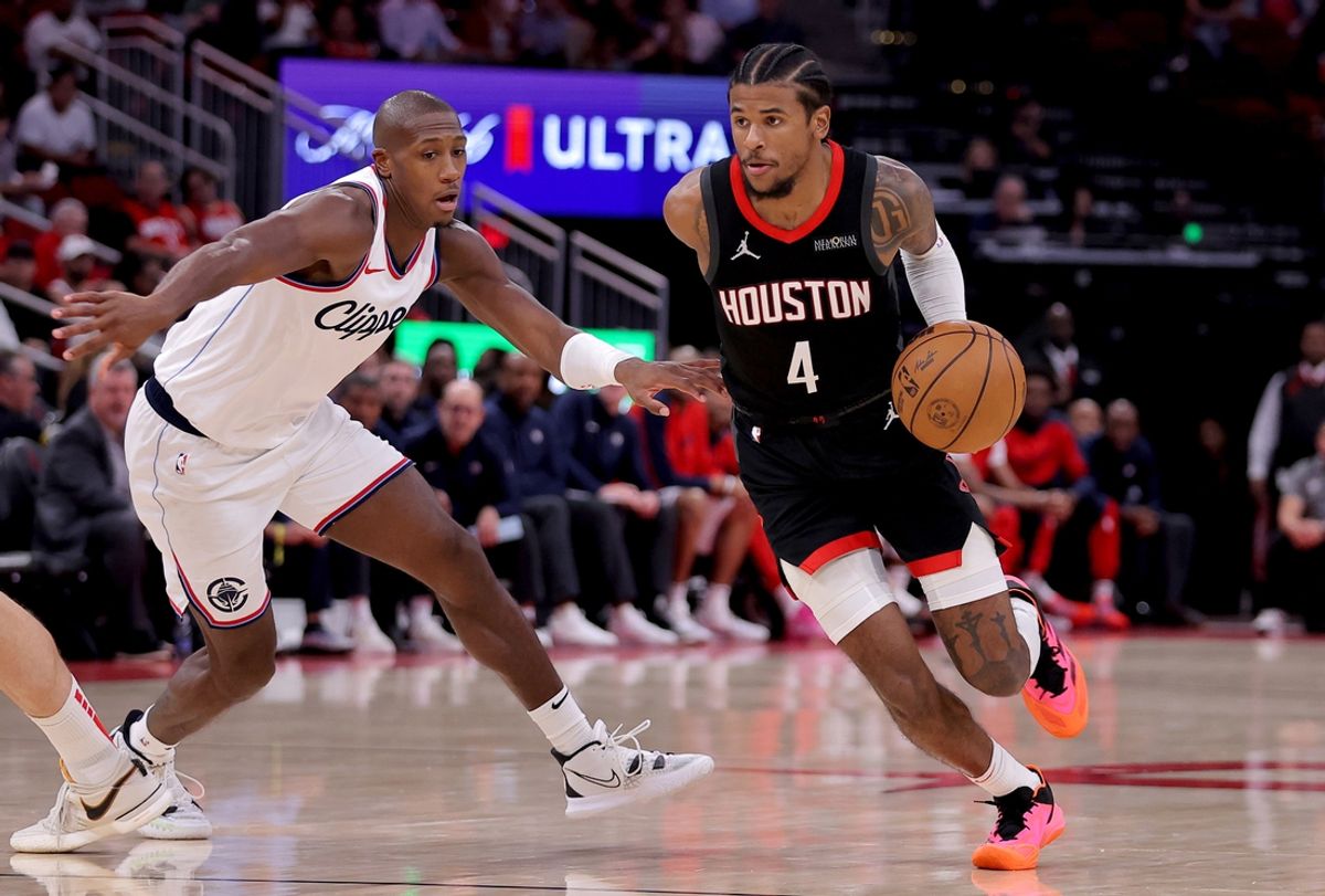 Nov 13, 2024; Houston, Texas, USA; Houston Rockets guard Jalen Green (4) handles the ball against LA Clippers guard Kris Dunn (8) during the third quarter at Toyota Center. Mandatory Credit: Erik Williams-Imagn Images