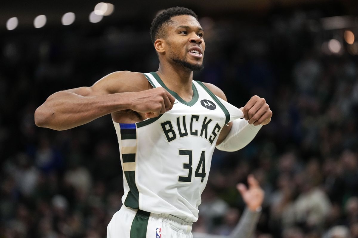 Nov 13, 2024; Milwaukee, Wisconsin, USA;  Milwaukee Bucks forward Giannis Antetokounmpo (34) celebrates after scoring during overtime against the Detroit Pistons at Fiserv Forum. Mandatory Credit: Jeff Hanisch-Imagn Images