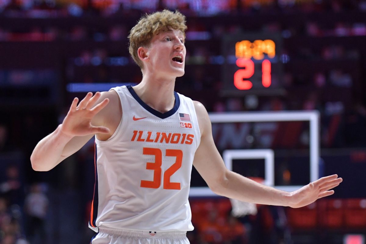 Nov 13, 2024; Champaign, Illinois, USA;  Illinois Fighting Illini guard Kasparas Jakucionis (32) reacts during the first half against the Oakland Golden Grizzlies at State Farm Center. Mandatory Credit: Ron Johnson-Imagn Images