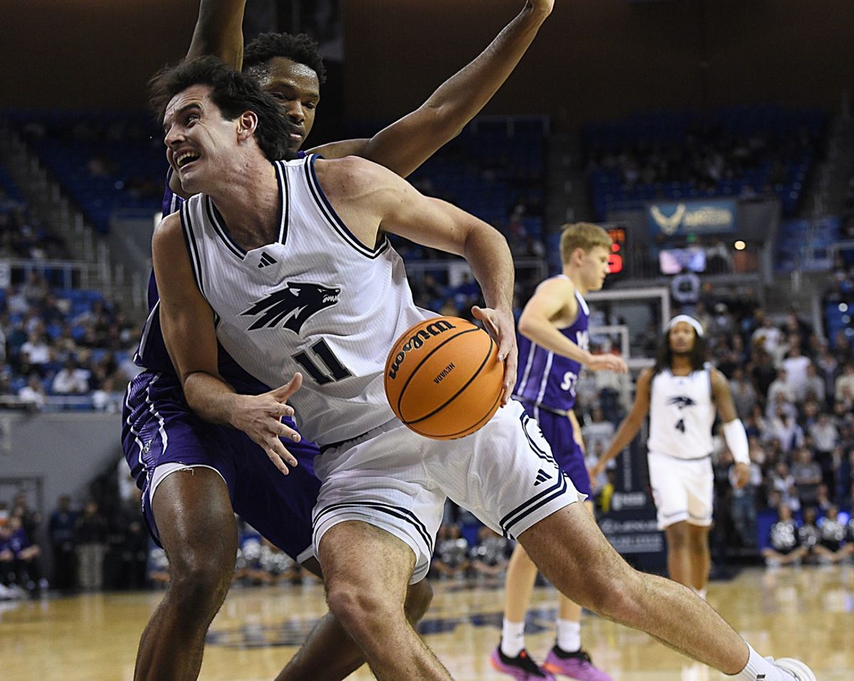 Nevada’s Nick Davidson drives while taking on Weber State at Lawlor Events Center in Reno on Nov. 13, 2024.
