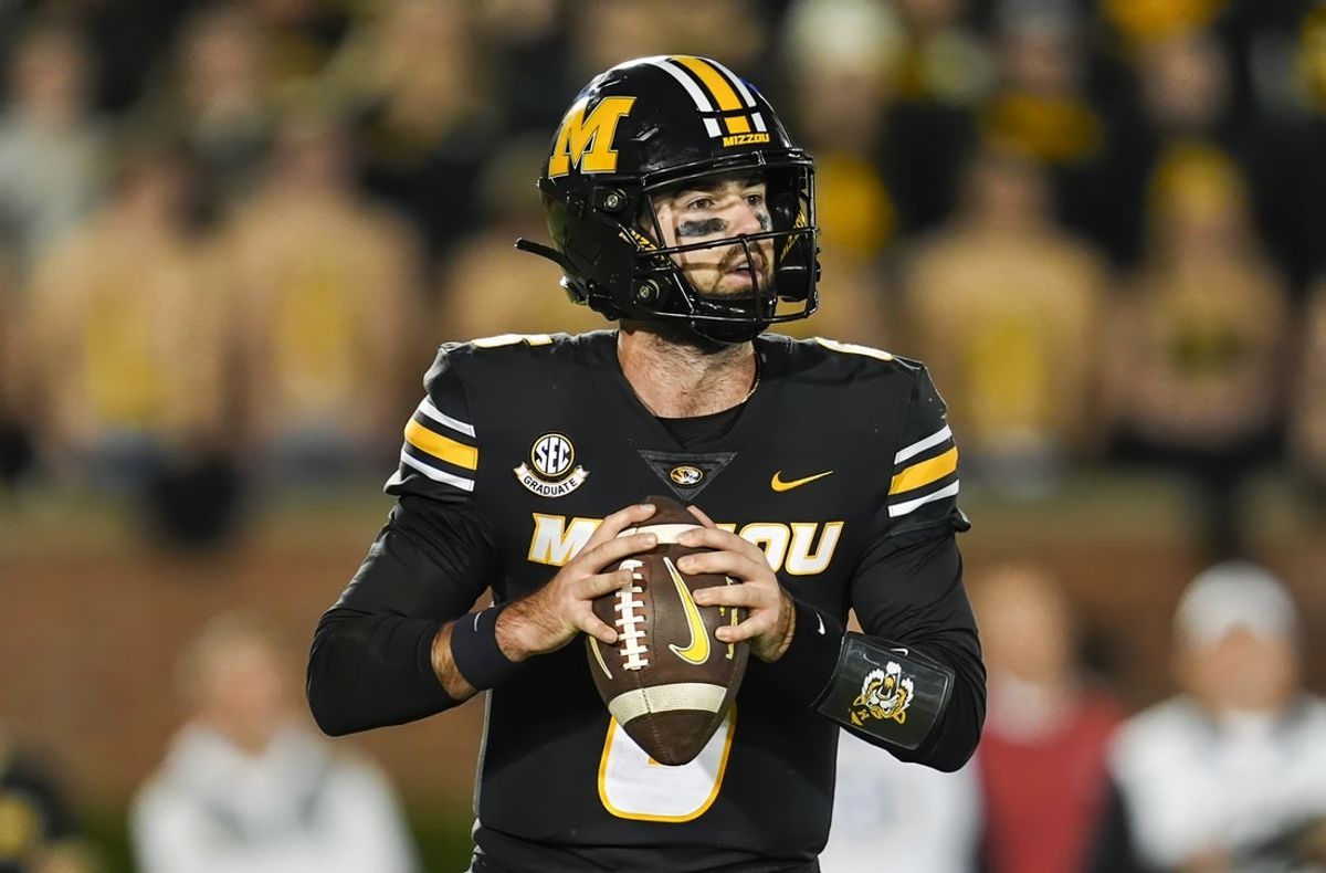 Nov 9, 2024; Columbia, Missouri, USA; Missouri Tigers quarterback Drew Pyne (6) drops back to pass during the second half against the Oklahoma Sooners at Faurot Field at Memorial Stadium. Mandatory Credit: Jay Biggerstaff-Imagn Images