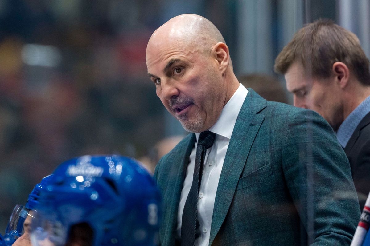Nov 12, 2024; Vancouver, British Columbia, CAN; Vancouver Canucks head coach Rick Tocchet on the bench against the Calgary Flames during the second period at Rogers Arena. Mandatory Credit: Bob Frid-Imagn Images
