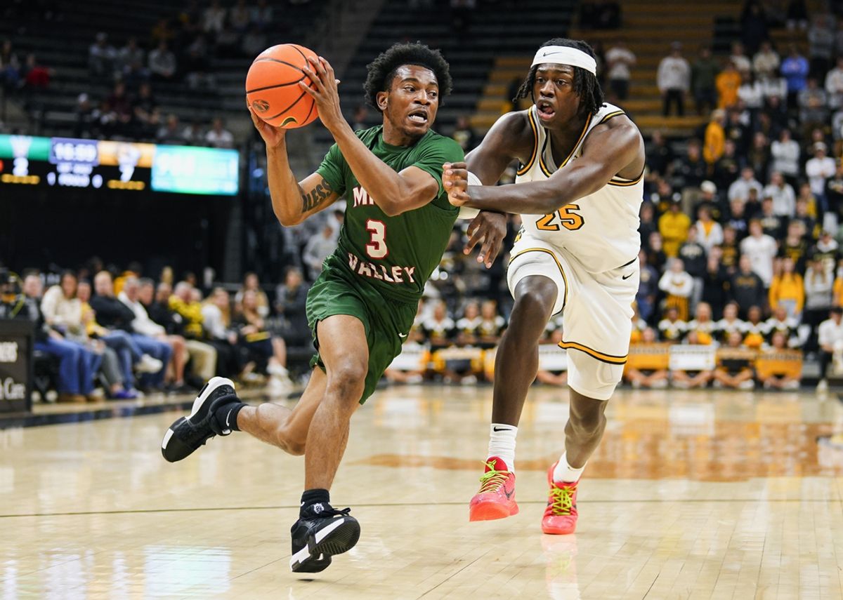 Nov 14, 2024; Columbia, Missouri, USA; Mississippi Valley State Delta Devils guard Donovan Sanders (3) drives against Missouri Tigers guard Mark Mitchell (25) during the first half at Mizzou Arena. Mandatory Credit: Jay Biggerstaff-Imagn Images