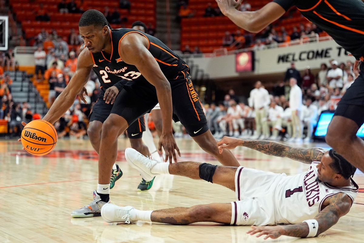 Oklahoma State's Abou Ousmane gets a loose ball from Southern Illinois' Elijah Elliott
during the college basketball game between the Oklahoma State University Cowboys and the Southern Illinois Salukis, Thursday, Nov. 14, 2024.
