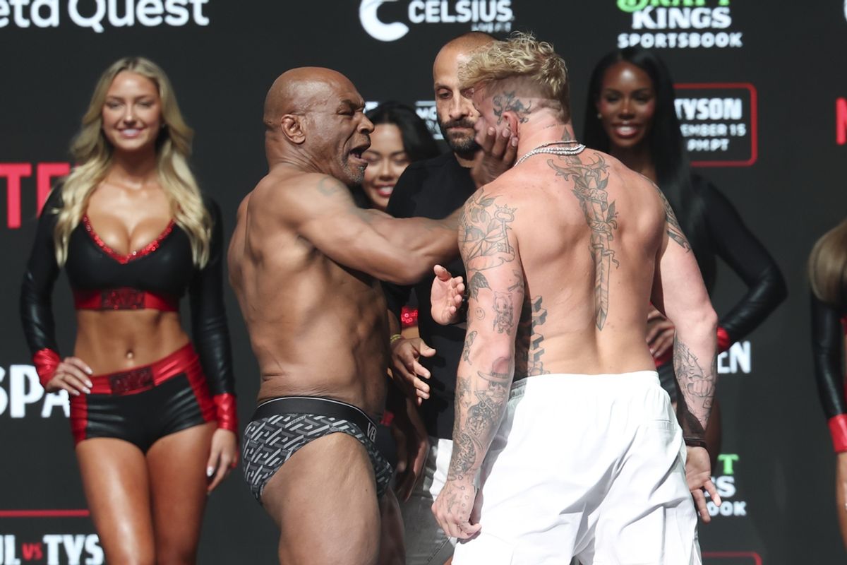 Nov 14, 2024; Irving, TX, USA;  Mike Tyson slaps Jake Paul after weighing in at the Toyota Music Factory.  Mandatory Credit: Kevin Jairaj-Imagn Images