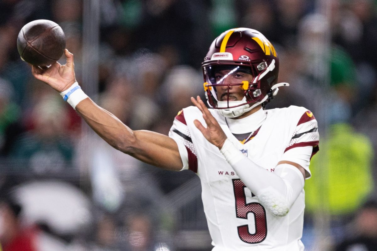 Nov 14, 2024; Philadelphia, Pennsylvania, USA; Washington Commanders quarterback Jayden Daniels (5) throws the ball against the Philadelphia Eagles during the second quarter at Lincoln Financial Field. Mandatory Credit: Bill Streicher-Imagn Images