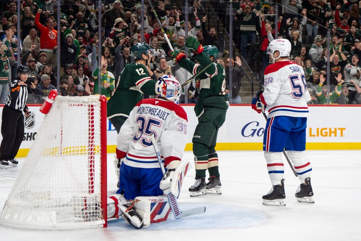 Nov 14, 2024; Saint Paul, Minnesota, USA; Minnesota Wild left wing Matt Boldy (12) is congratulated by center Marcus Johansson (90) after scoring on Montreal Canadiens goaltender Sam Montembeault (35) in the second period at Xcel Energy Center. Mandatory Credit: Matt Blewett-Imagn Images
