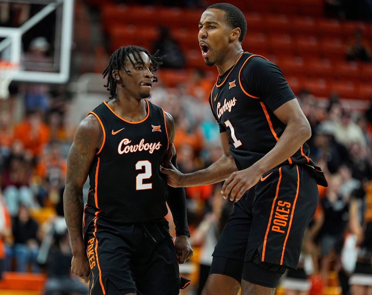 Oklahoma State's Arturo Dean (2) and Bryce Thompson celebrate during the college basketball game between the Oklahoma State University Cowboys and the Southern Illinois Salukis, Thursday, Nov. 14, 2024.