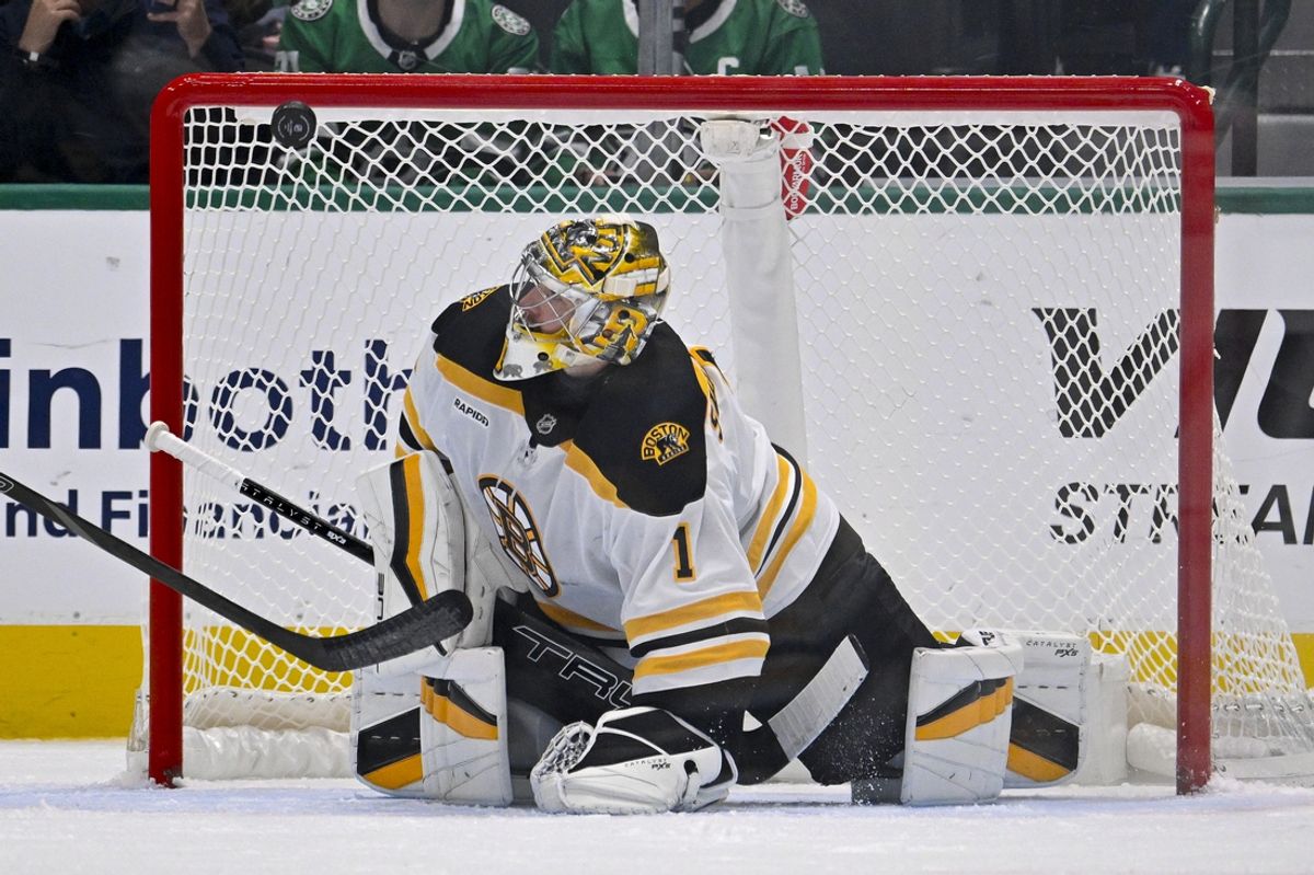 Nov 14, 2024; Dallas, Texas, USA; Boston Bruins goaltender Jeremy Swayman (1) makes a save on a Dallas Stars shot during the third period at the American Airlines Center. Mandatory Credit: Jerome Miron-Imagn Images