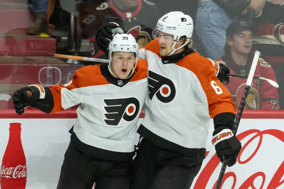 Nov 14, 2024; Ottawa, Ontario, CAN; Philadelphia Flyers right wing Matvei Michkov (39) celebrates with defenseman Travis Sanheim (6) his goal scored in overtime against the Ottawa Senators at the Canadian Tire Centre. Mandatory Credit: Marc DesRosiers-Imagn Images