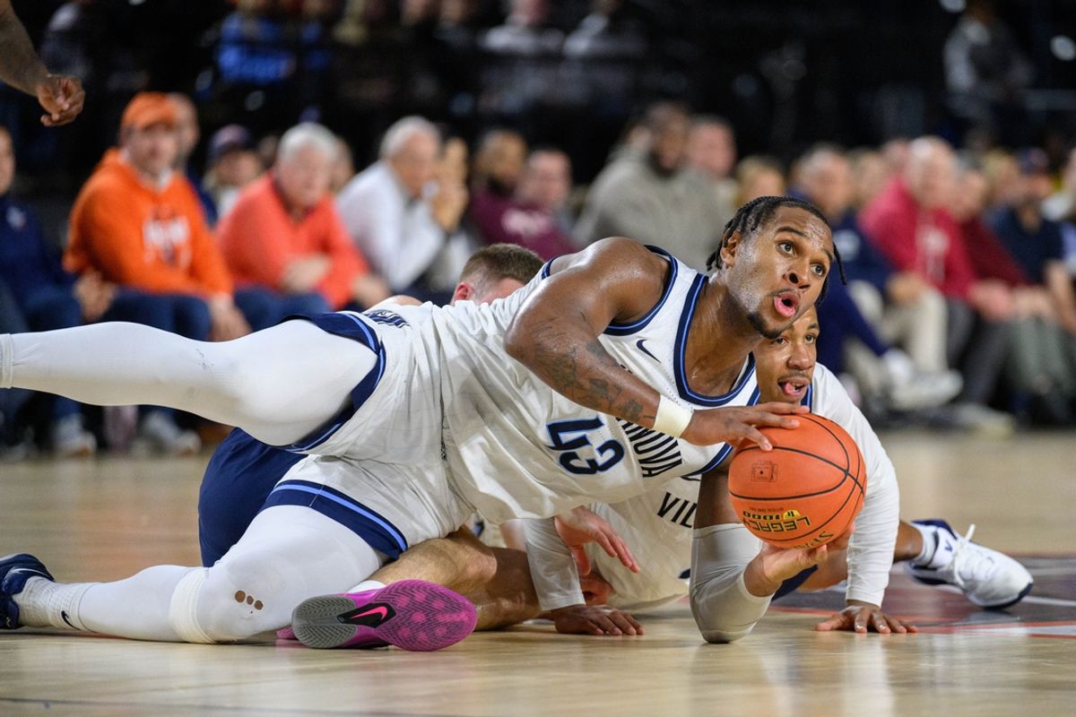 Nov 15, 2024; Baltimore, Maryland, USA; Villanova Wildcats forward Eric Dixon (43) grabs a loose ball against the Virginia Cavaliers during the second half at CFG Bank Arena. Mandatory Credit: Reggie Hildred-Imagn Images