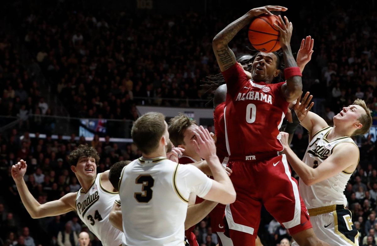 Alabama Crimson Tide guard Labaron Philon (0) grabs a rebound Friday, Nov. 15, 2024, during the NCAA men’s basketball game against the Purdue Boilermakers at Mackey Arena in West Lafayette, Ind.