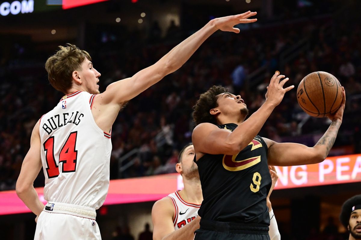 Nov 15, 2024; Cleveland, Ohio, USA; Cleveland Cavaliers guard Craig Porter Jr. (9) drives to the basket against Chicago Bulls forward Matas Buzelis (14) during the first half at Rocket Mortgage FieldHouse. Mandatory Credit: Ken Blaze-Imagn Images