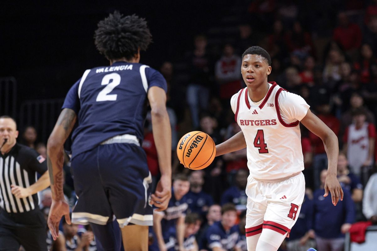 Nov 15, 2024; Piscataway, New Jersey, USA; Rutgers Scarlet Knights guard Ace Bailey (4) dribbles up court during the second half against Monmouth Hawks forward Jaret Valencia (2) at Jersey Mike's Arena. Mandatory Credit: Vincent Carchietta-Imagn Images