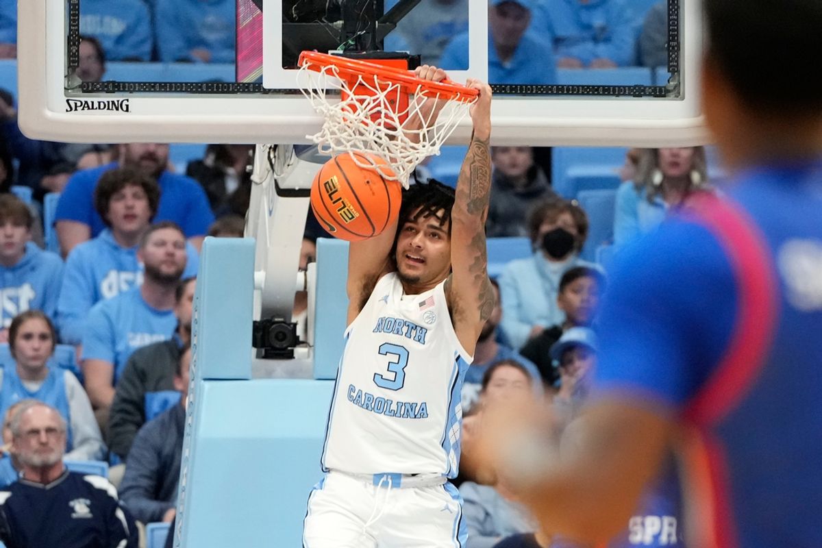 Nov 15, 2024; Chapel Hill, North Carolina, USA; North Carolina Tar Heels guard Elliot Cadeau (3) scores in the first half at Dean E. Smith Center. Mandatory Credit: Bob Donnan-Imagn Images