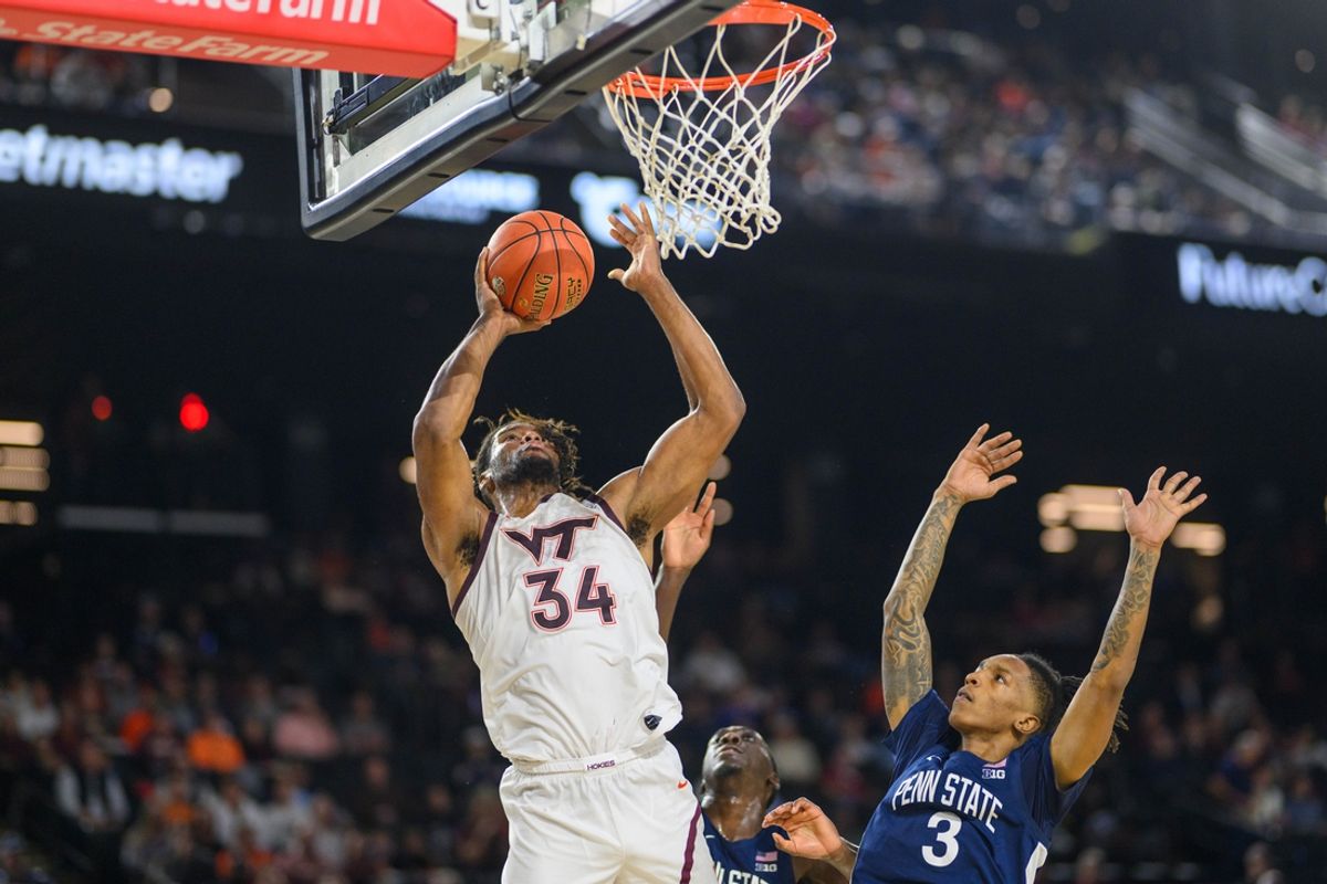 Nov 15, 2024; Baltimore, Maryland, USA; Virginia Tech Hokies forward Mylyjael Poteat (34) takes a shot over Penn State Nittany Lions guard Nick Kern Jr. (3) during the first half at CFG Bank Arena. Mandatory Credit: Reggie Hildred-Imagn Images
