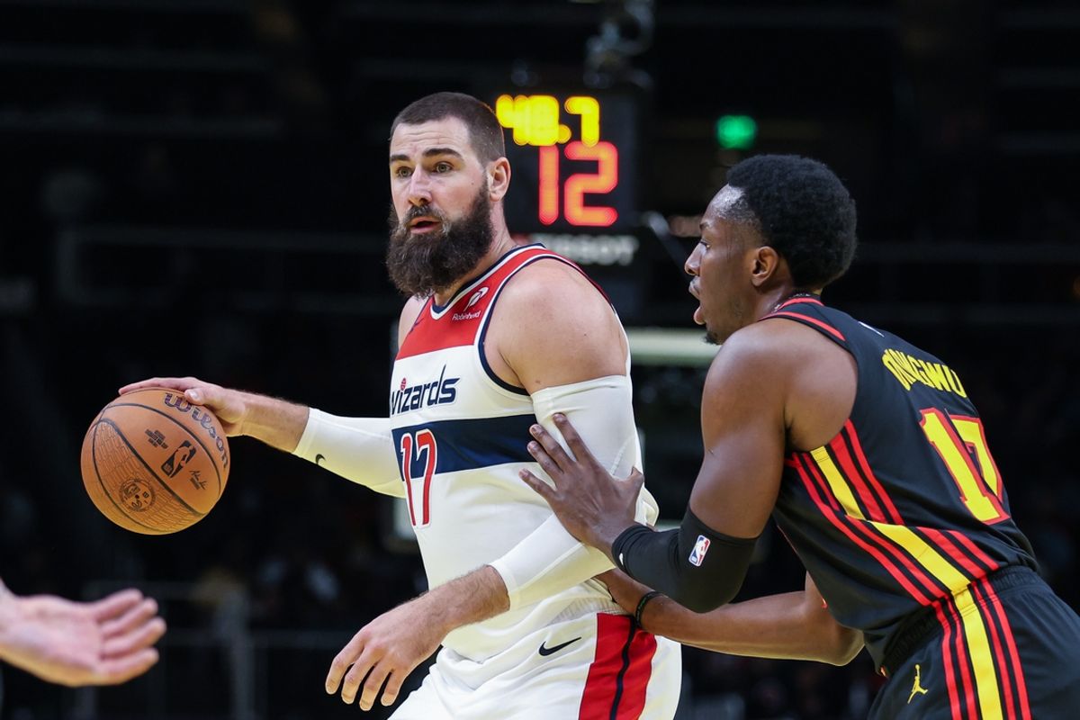 Nov 15, 2024; Atlanta, Georgia, USA; Atlanta Hawks forward Onyeka Okongwu (17) plays defense against Washington Wizards center Jonas Valanciunas (17) during the first quarter at State Farm Arena. Mandatory Credit: Jordan Godfree-Imagn Images