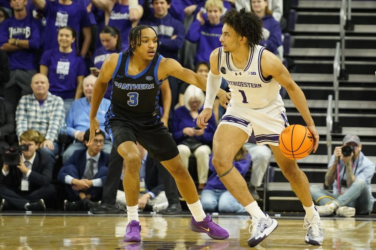 Nov 15, 2024; Evanston, Illinois, USA; Eastern Illinois Panthers guard Nakyel Shelton (3) defends Northwestern Wildcats guard Jalen Leach (1) during the first half at Welsh-Ryan Arena. Mandatory Credit: David Banks-Imagn Images
