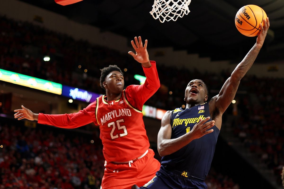 Nov 15, 2024; College Park, Maryland, USA; Marquette Golden Eagles guard Kam Jones (1) takes a shot over Maryland Terrapins center Derik Queen (25) during the first half against the at Xfinity Center. Mandatory Credit: Daniel Kucin Jr.-Imagn Images